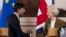 FILE - Britain's Prime Minister Rishi Sunak and EU Commission President Ursula von der Leyen, right, shake hands on Feb. 27, 2023. Britain is rejoining the European Union’s science-sharing program Horizon Europe. 
