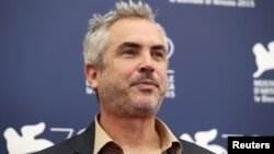 Mexican film director Alfonso Cuaron, a member of the jury at the 72nd Venice Film Festival, poses during a photo call for the event in Venice, Italy, Sept. 2, 2015.