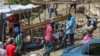 Residents of the Nazon neighborhood displaced by gang violence construct a tent encampment in Port-au-Prince, Haiti, Nov. 15, 2024.