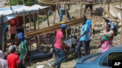 Residents of the Nazon neighborhood displaced by gang violence construct a tent encampment in Port-au-Prince, Haiti, Nov. 15, 2024.