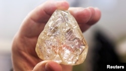 FILE - A 709-carat diamond, found in Sierra Leone and known as the "Peace Diamond", is displayed during a tour ahead of its auction, at Israel's Diamond Exchange, in Ramat Gan, Israel, Oct. 19, 2017. 