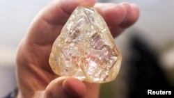 A 709-carat diamond, found in Sierra Leone and known as the "Peace Diamond", is displayed during a tour ahead of its auction, at Israel's Diamond Exchange, in Ramat Gan, Israel, Oct. 19, 2017. 