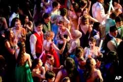 FILE - A group dances during senior prom at Northwest High School in Silver Spring, Maryland, May 13, 2016.