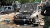 Witness: Nigeria Blasts Kill Dozens