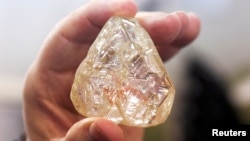 A 709-carat diamond, found in Sierra Leone and known as the "Peace Diamond", is displayed during a tour ahead of its auction, at Israel's Diamond Exchange, in Ramat Gan, Israel, Oct. 19, 2017. (REUTERS/Nir Elias)