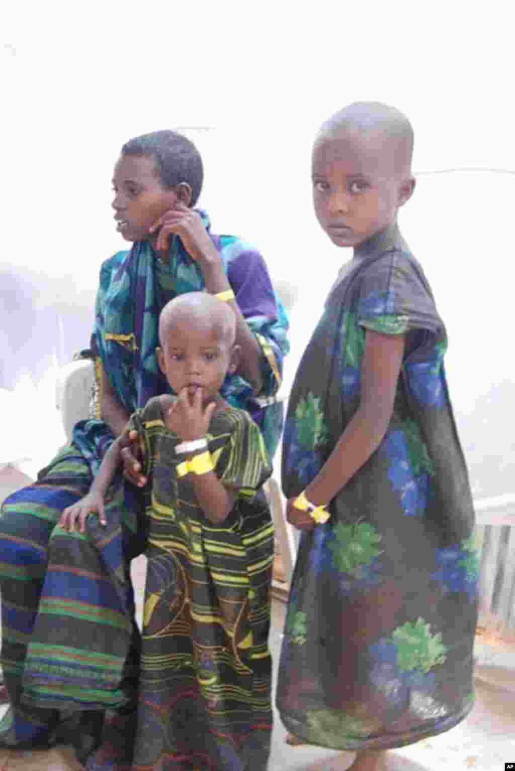 Boys sometimes dress as girls on the journey to avoid being taken and pressed into service at checkpoint set up by Islamic extremist groups that control much of southern Somalia. VOA - P. Heinlein