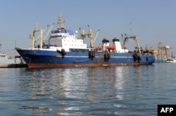 FILE - A Russian trawler "Oleg Naïdenov", is moored in Dakar on Jan. 5, 2014. The ship was boarded after it was observed illegally fishing in Senegalese waters near the border with Guinea Bissau.
