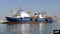FILE - A Russian trawler "Oleg Naïdenov",is moored in Dakar on January 5, 2014. The ship was boarded after it was observed illegally fishing in Senegalese waters near the border with Guinea Bissau.