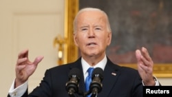 U.S. President Joe Biden speaks about the aid package for Ukraine from the State Dining Room of the White House in Washington on Feb. 13, 2024. He said, "America can be relied upon, and America stands up for freedom."