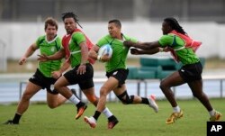 South Africa's Cheslin Kolbe runs with the ball during a men's rugby sevens team training session ahead of the 2016 Summer Olympics in Rio de Janeiro, Brazil, Aug. 3, 2016.