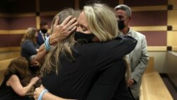  Gena Hoyer, right, hugs Debbie Hixon during a court recess following Marjory Stoneman Douglas High School shooter Nikolas Cruz's guilty plea on all 17 counts of premeditated murder and 17 counts of attempted murder in the 2018 shootings, Oct. 20, 2021.