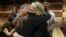  Gena Hoyer, right, hugs Debbie Hixon during a court recess following Marjory Stoneman Douglas High School shooter Nikolas Cruz's guilty plea on all 17 counts of premeditated murder and 17 counts of attempted murder in the 2018 shootings, Oct. 20, 2021.