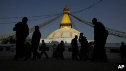 Buddhists and tourists take a round of Bodhnath stupa, in Katmandu, Nepal, Thursday, March 5, 2009. Situated on an early trade route between Katmandu and Lhasa, Bodhnath was a religious site. The present stupa, Nepalís largest, was constructed probably in