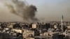 Smoke billows over buildings following Israeli bombardment in Rafah in the southern Gaza Strip on March 27, 2024, amid the ongoing conflict between Israel and the Palestinian militant group Hamas. (Photo by SAID KHATIB / AFP)