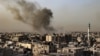 FILE - Smoke billows over buildings in Rafah in the southern Gaza Strip on March 27, 2024, amid the ongoing conflict between Israel and the Palestinian militant group Hamas. 