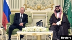 Russian President Vladimir Putin and Saudi Arabia's Crown Prince Mohammed bin Salman attend a meeting in Riyadh, Saudi Arabia, Oct. 14, 2019. 