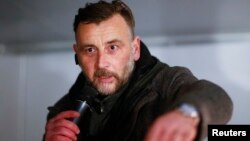 FILE - Lutz Bachmann of anti-immigration group PEGIDA (Patriotic Europeans Against the Islamization of the West) speaks during a demonstration in Dresden, Dec. 15, 2014.