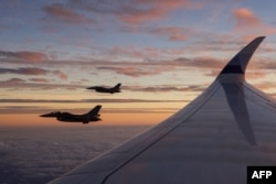 TOPSHOT - F-16 jets escort the plane of Taiwan's President Lai Ching-te who embarked on a trip to visit Taiwan's allies in the Pacific, on November 30, 2024.