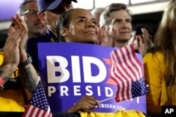 People applaud as former Vice President and Democratic presidential candidate Joe Biden speaks during a rally at the Teamster Local 249 Hall in Pittsburgh, April 29, 2019.