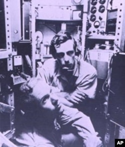 Lt. Don Walsh (left) and Jacques Piccard (center) in cramped quarters inside Trieste's chamber on January 23, 1960.