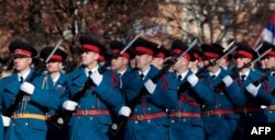 Bosnian Serb police officers take part in a parade marking the "Day of Republic Srpska," in Banja Luka, Jan. 9, 2019, defying a 2016 legal ban and angering Bosnian Muslims who viewed it as a provocation.