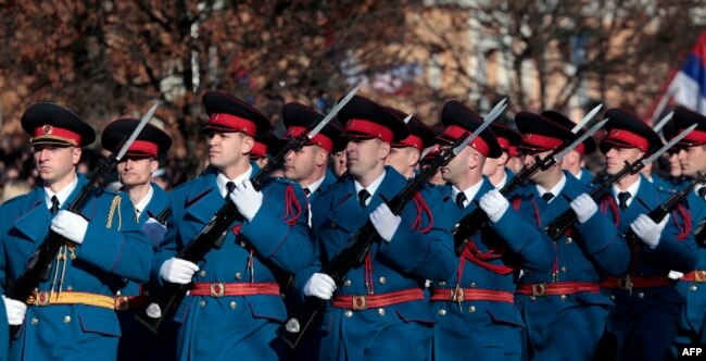 Bosnian Serb police officers take part in a parade marking the "Day of Republic Srpska," in Banja Luka, Jan. 9, 2019, defying a 2016 legal ban and angering Bosnian Muslims who viewed it as a provocation.