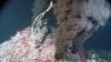 A hydrothermal vent emits jet-black smoke. This material is usually made of minerals that solidify and form chimneys on the sea floor. However, hydrogen can also be a byproduct of vents. (Photo courtesy of National Oceanic and Atmospheric Administration) 