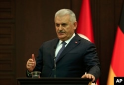 Turkey's Prime Minister Binali Yildirim speaks during a press conference with German Chancellor Angela Merkel after their meeting in Ankara, Feb. 2, 2017.