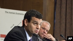 Treasury Undersecretary David Cohen, left, accompanied by Commerce Undersecretary David Mills, testifies on Capitol Hill in Washington, October 13, 2011.