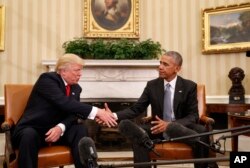 President Barack Obama shakes hands with President-elect Donald Trump in the Oval Office of the White House in Washington, Nov. 10, 2016.