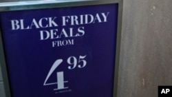 An H&M store advertises "Black Friday Deals" on Saturday, Nov. 23, 2013, in New York. 