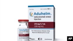 FILE - This image provided by Biogen on Monday, June 7, 2021 shows a vial and packaging for the drug Aduhelm.