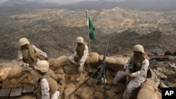 FILE - Saudi soldiers occupy a position on Mount Doud, a high strategic position in Jizan province, near the border with Yemen, Jan. 27, 2010. A missile attack from Yemen killed three civilians in the province on June 9, 2018, Saudi state TV reported.