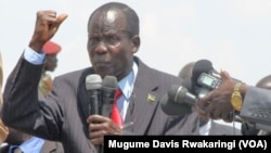 South Sudan Vice President James Wani Igga, shown here addressing demonstrators at a peace rally in Juba in March 2014, urges South Sudanese who have fled the country to come home and help build a unified nation.