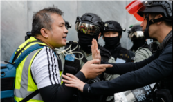 香港记者协会主席陈朗升在2019年“反送中”抗争中进行采访活动。（陈朗升授权使用）