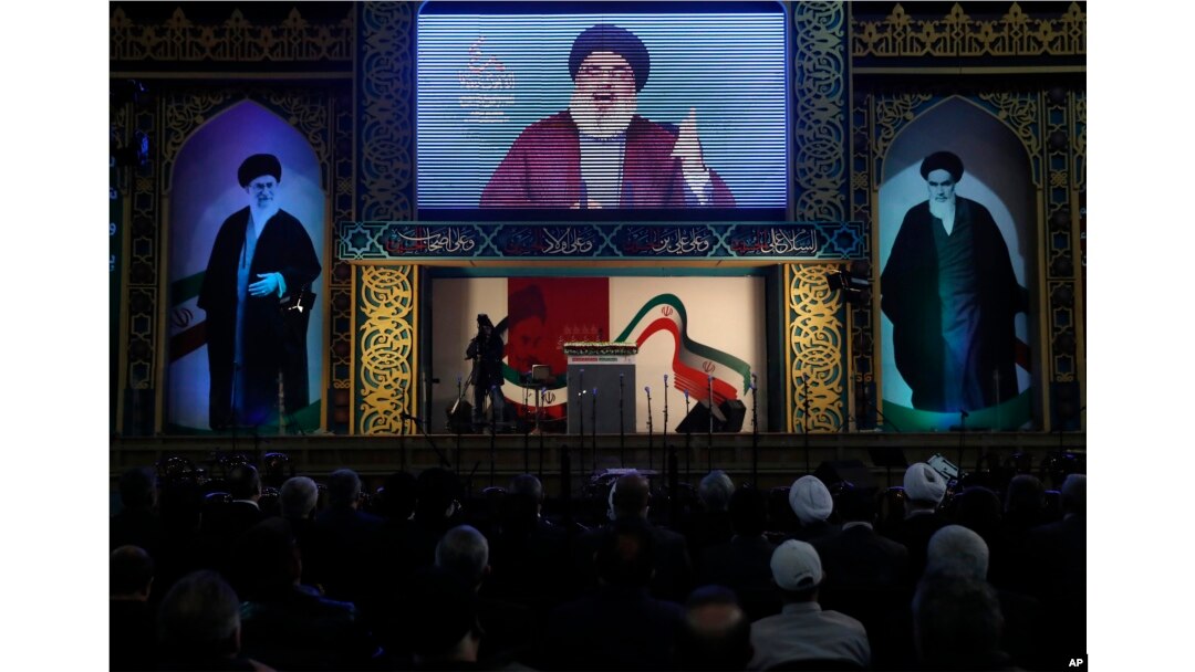 FILE - Hezbollah leader Hassan Nasrallah delivers a broadcast speech during a rally to commemorate the 40th anniversary of Iran's Islamic Revolution, in southern Beirut, Lebanon, Feb. 6, 2019.