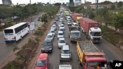 FILE - Drivers sit in queues of traffic on a highway in downtown Nairobi, Kenya, April 14, 2015. Uber is testing a low-cost, quick-trip option in the city. 