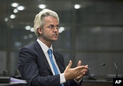 FILE - Geert Wilders gestures during an interview with The Associated Press in The Hague, Netherlands, July 15, 2010.
