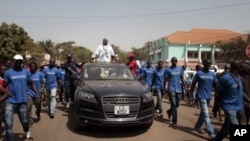 Presidential candidate Serifo Nhamadjo rallies voters on the streets of Guinea Bissau's capital during the final day of campaigning ahead of Sunday's presidential elections, Friday, March 16, 2012. 