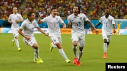 Jermaine Jones of the U.S. celebrates with Alejandro Bedoya (11), Matt Besler (5) and DaMarcus Beasley after scoring a goal during the 2014 World Cup G soccer match between Portugal and the U.S. at the Amazonia arena in Manaus June 22, 2014.