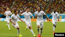 Jermaine Jones of the U.S. celebrates with Alejandro Bedoya (11), Matt Besler (5) and DaMarcus Beasley after scoring a goal during the 2014 World Cup G soccer match between Portugal and the U.S. at the Amazonia arena in Manaus June 22, 2014.