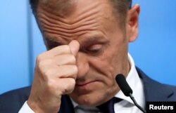 European Council President Donald Tusk reacts as he holds a news conference after an extraordinary European Union leaders summit to discuss Brexit, in Brussels, Belgium, April 11, 2019.