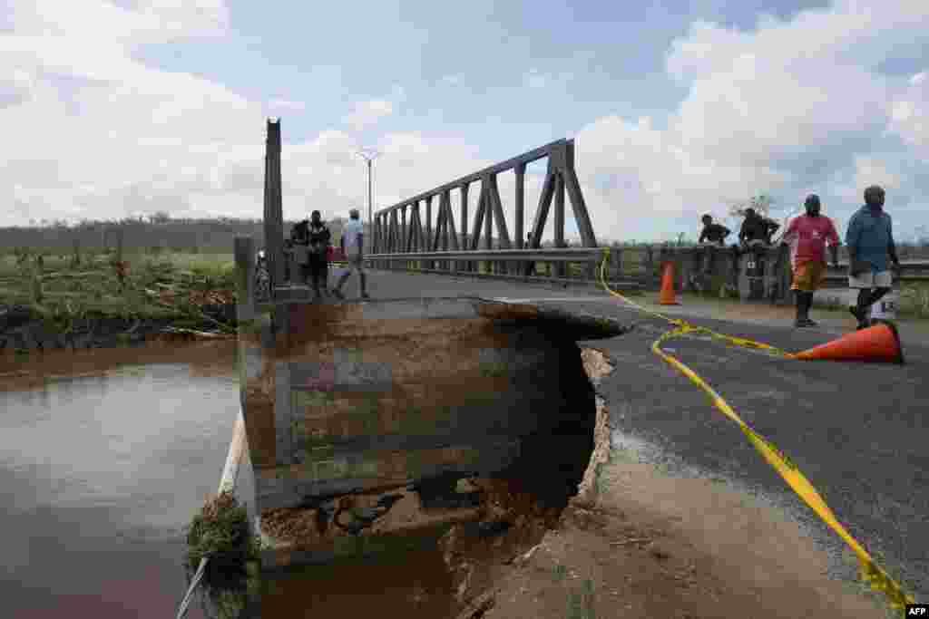 This handout photo taken and received on March 15, 2015 by UNICEF Pacific shows damage to a bridge, caused by Cyclone Pam, outside Port Vila.