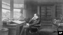 Charles Dickens in his office
