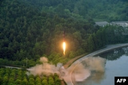 This undated photo released by North Korea's official Korean Central News Agency (KCNA) on May 30, 2017 shows a test-fire of a ballistic missile at an undisclosed location in North Korea.