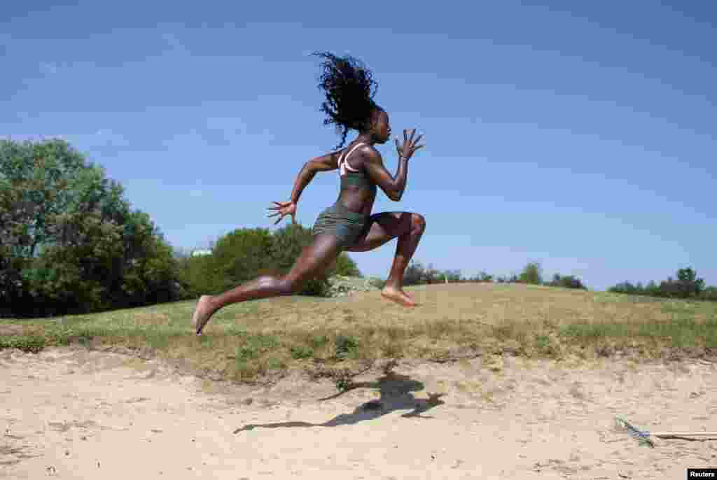 British athlete Desiree Henry trains at a golf course in Edmonton London, April 26, 2020.