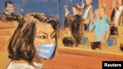 Ghislaine Maxwell sits as the jurors are sworn in at the start of her trial on charges of sex trafficking, in a courtroom sketch in New York City, Nov. 29, 2021. 