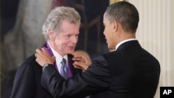 President Barack Obama presents a 2010 National Medal of Arts to pianist Van Cliburn, March 2, 2011, during a ceremony in the East Room of the White House in Washington.