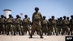 FILE - Mozambican soldiers stand in formation in Pemba, Cabo Delgado province, Mozambique, Sept. 24, 2021.