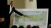 FILE - Former President Barack Obama points to a rendering for the former president's lakefront presidential center at a community event at the South Shore Cultural Center in Chicago, Illinois, May 3, 2017. 